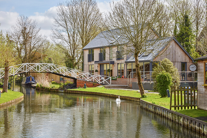 contemporary green architecture in Berkshire along canal