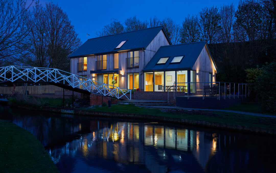 lock-keepers-canal-cottage-at-night-green-architecture